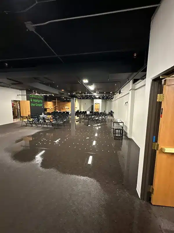 Standing water on the floor of a flooded commercial space