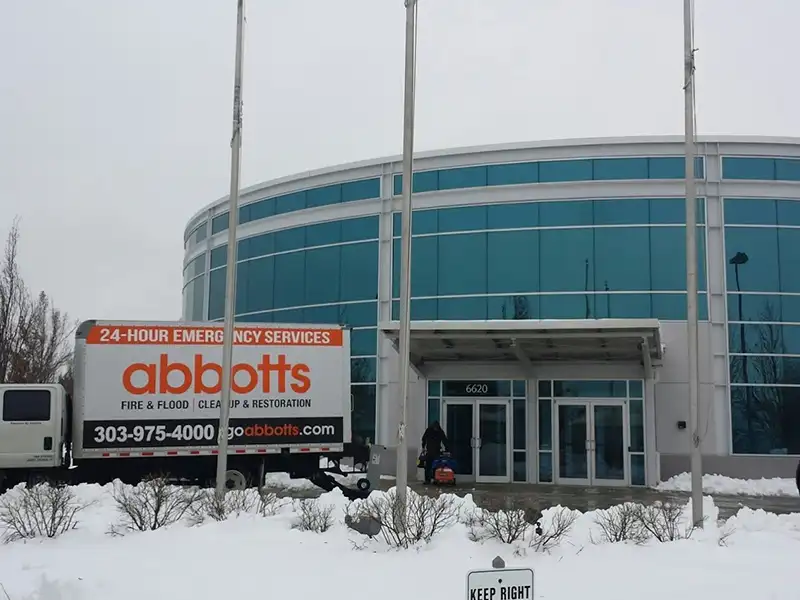 Abbott's truck outside a commercial building in the snow
