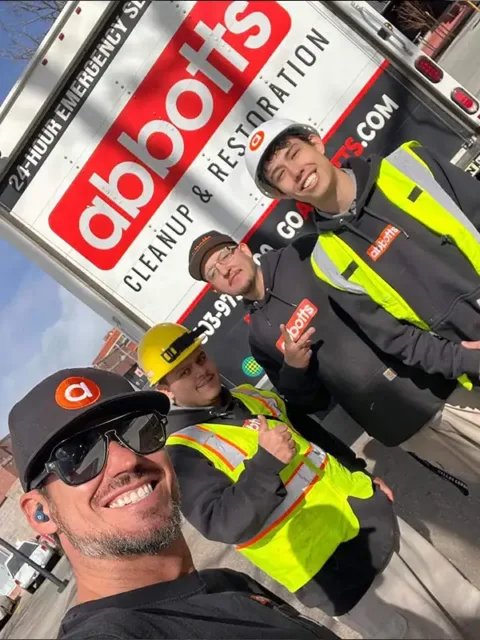 water-7 Abbott's team members in safety vests in front of a company truck